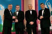 30 November 2001; Kevin Broderick, Galway, receives his award from An Taoiseach Bertie Ahern TD, Paul Donovan, Chief Executive, Eircell Vodafone and Sean McCague, President, Cumann Luthchleas Gael, at the Eircell Vodafone AllStar Awards at the CityWest Hotel, Dublin. Hurling. Picture credit; Ray McManus / SPORTSFILE *EDI*