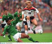 29 May 1994; Phil Babb, Republic of Ireland, in action against Jurgen Klinsmann, Germany. Friendly International, Rep of Ireland v Germany, Stuttgart, Germany. Picture credit: Ray McManus/SPORTSFILE