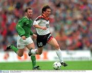 29 May 1994. Lothar Matthaus, Germany, in action against John Sheridan, Ireland. Friendly International, Rep of Ireland v Germany, Stuttgart, Germany. Picture Credit: Ray McManus/SPORTSFILE.