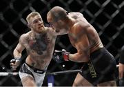 12 November 2016; Conor McGregor, left, in action against Eddie Alvarez during their lightweight title bout at UFC 205 in Madison Square Garden, New York. Photo by Adam Hunger/Sportsfile