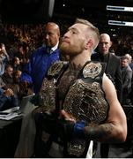 12 November 2016; Conor McGregor leaves the octagon with his Lightweight and Featherweight belts after defeating Eddie Alvarez following their lightweight title bout at UFC 205 in Madison Square Garden, New York. Photo by Adam Hunger/Sportsfile