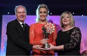 12 November 2016; Bríd Stack of Cork is presented with her All Star award by Marie Hickey, President, LGFA, in the company of Alan Esslemont, Ard Stiúrthóir, TG4, at the TG4 Ladies Football All Stars awards in Citywest Hotel in Dublin. Photo by Brendan Moran/Sportsfile