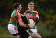 13 November 2016; Mike Milner of Dr Crokes in action against Joseph Hennessy, left, and John McGrath of Loughmore Castleiney during the AIB Munster GAA Football Senior Club Championship semi-final game between Dr. Crokes and Loughmore - Castleiney in Killarney Co Kerry. Photo by Diarmuid Greene/Sportsfile