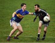 13 November 2016; Conor Laverty of Kilcoo in action against Kevin Nugent of Maghery Sean MacDiarmada during the AIB Ulster GAA Football Senior Club Championship semi-final game between Kilcoo and Maghery Sean MacDiarmada at Park Esler in Newry. Photo by Philip Fitzpatrick/Sportsfile