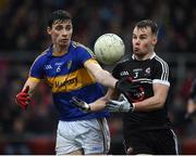 13 November 2016; Darragh O'Hanlon of Kilcoo in action against Ciaran Higgins of Maghery Sean MacDiarmada during the AIB Ulster GAA Football Senior Club Championship semi-final game between Kilcoo and Maghery Sean MacDiarmada at Park Esler in Newry. Photo by Philip Fitzpatrick/Sportsfile