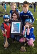 14 November 2016; ESB, Official Energy Partner to the GAA, presents Kevin's Hurling and Camogie Club in Dublin with a cheque for Ä1,500. The prize is part of ESBís GAA Fund whereby ESB staff members nominated a local GAA club that is making a difference in the community. Over the coming weeks, a grand total of Ä30,000 will be awarded to 18 GAA clubs across the country. Pictured at the presentation are Louise Davis, ESB staff member, with Kevin's Hurling and Camogie Club players Oliver Davey, back left, 12 years, Dean McKeever, 13, back right, TJ Mannion, 2, left, and Emma Chambers, 7, at the Club's playing grounds, Dolphin Park, Crumlin Road, Dublin. Photo by Ray McManus/Sportsfile