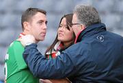 17 March 2011; The St Brigids captain Frankie Dolan is comforted by his wife Caroline and father in law Padraig Gannon as the presentation is in progress. AIB GAA Football All-Ireland Senior Club Championship Final, St Brigids v Crossmaglen Rangers, Croke Park, Dublin. Picture credit: Ray McManus / SPORTSFILE
