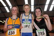 2 April 2011; U-18 Girl's 1500m walk winner Kate Veale, West Waterford, centre with second place Claudia Loughnane, Marian, Co. Clare left, and third place Cliona Mulroy, Swinford, Co. Mayo. Woodie’s DIY Juvenile Indoor Championships, Nenagh Indoor Stadium, Nenagh, Co. Tipperary. Picture credit: Barry Cregg / SPORTSFILE