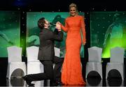12 November 2016; Seán Costello of The Galway Tenors performs with the help of Bríd Stack of Cork on stage during the TG4 Ladies Football All Star awards at the Citywest Hotel in Dublin.  Photo by Cody Glenn/Sportsfile