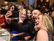 12 November 2016; Frank Naughton of The Galway Tenors takes a selfie with attendees during the TG4 Ladies Football All Star awards at the Citywest Hotel in Dublin.  Photo by Brendan Moran/Sportsfile