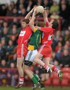 3 April 2011; Gerard O'Kane, left, and Dermot McBride, Derry, in action against Brian Farrell, Meath. Allianz Football League Division 2 Round 6, Derry v Meath, Celtic Park, Derry. Photo by Sportsfile