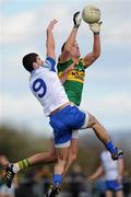 3 April 2011; Anthony Maher wins possession for Kerry under pressure from his Monaghan marker Neil McAdam.  Allianz Football League Division 1 Round 6, Monaghan v Kerry, Inniskeen, Co. Monaghan. Picture credit: Ray McManus / SPORTSFILE