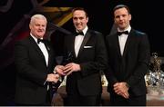 3 November 2017; London hurler Enda Cooney is presented with his Christy Ring Champion 15 award by Uachtarán Chumann Lúthchleas Gael Aogán Ó Fearghail, left, and David Collins, GPA President, during the PwC All Stars 2017 at the Convention Centre in Dublin. Photo by Piaras Ó Mídheach/Sportsfile