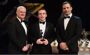 3 November 2017; Down hurler Michael Hughes is presented with his Christy Ring Champion 15 award by Uachtarán Chumann Lúthchleas Gael Aogán Ó Fearghail, left, and David Collins, GPA President, during the PwC All Stars 2017 at the Convention Centre in Dublin. Photo by Piaras Ó Mídheach/Sportsfile