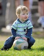6 April 2011; Jack Moran, aged 2, from Terrenure, Dublin, plays with a ball after the game. Leinster Schools Senior Seconds Final, Blackrock College v Clongowes Wood College SJ, Templeville Road, Dublin. Picture credit: Barry Cregg / SPORTSFILE