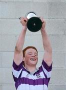 6 April 2011; Clongowes Wood College SJ's Peadar Timmons lifts the cup after the game. Leinster Schools Senior Seconds Final, Blackrock College v Clongowes Wood College SJ, Templeville Road, Dublin. Picture credit: Barry Cregg / SPORTSFILE