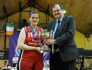 23 March 2011; Sarah Breathnach, Pobail Scoil Chorca Dhuibhne, Co. Kerry, is presented with the cup by Bernard O'Byrne, Secretary General of Basketball Ireland. Basketball Ireland Girls U19A Schools League Final, Pobail Scoil Chorca Dhuibhne, Co. Kerry v St. Josephs, Abbeyfeale, Co. Limerick, National Basketball Arena, Tallaght, Co. Dublin. Picture credit: Brian Lawless / SPORTSFILE