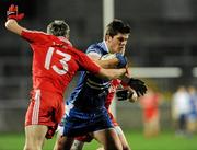 6 April 2011; Pete Dooney, Monaghan, in action against Kyle Coney and Richard Donnelly, Tyrone. Cadbury Ulster GAA Football Under 21 Championship Semi-Final, Monaghan v Tyrone, Brewester Park, Enniskillen, Co. Fermanagh. Picture credit: Oliver McVeigh / SPORTSFILE