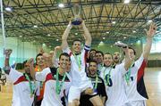 9 April 2011; Hygo Cesar, EID Futsal, captain lifts the cup as his team-mates celebrate after the game against Blue Magic. FAI Futsal Cup Final, EID Futsal v Blue Magic,  Gormanston College, Gormanston, Co. Meath. Picture credit: Matt Browne / SPORTSFILE