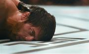 19 November 2016; Magomed Mustafaev lies on the canvas unconcious after being choked out by Kevin Lee during their Lightweight bout at UFC Fight Night 99 in the SSE Arena, Belfast. Photo by David Fitzgerald/Sportsfile