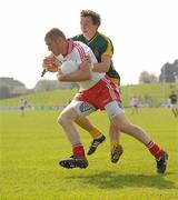 10 April 2011; Kevin Hughes, Tyrone, in action against Seamus Kenny, Meath. Allianz Football League, Division 2, Round 7, Meath v Tyrone, Pairc Tailteann, Navan, Co. Meath. Photo by Sportsfile