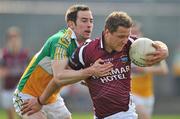 10 April 2011; Paul Greville of Westmeath in action against Joe Quinn of Offaly during the Allianz Football League, Division 2 Round 7 match between Westmeath and Offaly at Cusack Park in Mullingar, Westmeath. Photo by David Maher/Sportsfile