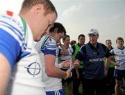10 April 2011; Monaghan manager Eamon McEneaney speaks to his players as they wait to hear results from the other matches in Division 1. Allianz Football League, Division 1, Round 7, Monaghan v Mayo, Inniskeen, Co. Monaghan. Picture credit: Brian Lawless / SPORTSFILE