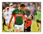 16 July 2016; A job well done. Mayo’s Barry Moran gets a pat on the back from young supporter Daniel McHale after the county’s win over Kildare. Momentum is being generated in the qualifier route  Photo by Stephen McCarthy/Sportsfile  This image may be reproduced free of charge when used in conjunction with a review of the book &quot;A Season of Sundays 2016&quot;. All other usage © SPORTSFILE