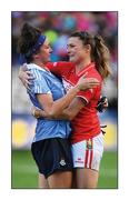 25 September 2016; Gracious and empathetic. Cork’s Annie Walsh, looking almost as upset as Niamh McEvoy of Dublin, commiserates with her opponent following the reigning champions’ one-point win  Photo by Brendan Moran/Sportsfile  This image may be reproduced free of charge when used in conjunction with a review of the book &quot;A Season of Sundays 2016&quot;. All other usage © SPORTSFILE