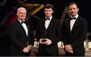 3 November 2017; Antrim hurler Paddy Burke is presented with his Christy Ring Champion 15 award by Uachtarán Chumann Lúthchleas Gael Aogán Ó Fearghail, left, and David Collins, GPA President, during the PwC All Stars 2017 at the Convention Centre in Dublin. Photo by Piaras Ó Mídheach/Sportsfile