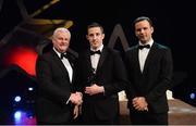 3 November 2017; Carlow hurler Alan Corcoran is presented with his Christy Ring Champion 15 award by Uachtarán Chumann Lúthchleas Gael Aogán Ó Fearghail, left, and David Collins, GPA President, during the PwC All Stars 2017 at the Convention Centre in Dublin. Photo by Piaras Ó Mídheach/Sportsfile