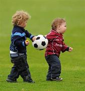 10 April 2011; One and a half year old Liam McGrath, from, Knock na Carra, Galway, and two and a half year old Jamie Brogan, from Castleknock, Dublin, play football during the half-time break. Allianz Football League, Division 1, Round 7, Galway v Dublin, Pearse Stadium, Salthill, Galway. Picture credit: Ray McManus / SPORTSFILE