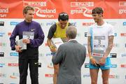 10 April 2011; Race winner Jesus Espana, Spain, is presented with his prize by Willie O' Byrne, Managing Director, SPAR Ireland, alongside second place Jussi Utriainen, Finland, left, and third place Martin Fagan, Mullingar A.C., Westmeath, following the SPAR Great Ireland Run 2011. Phoenix Park, Dublin, Dublin. Picture credit: Stephen McCarthy / SPORTSFILE
