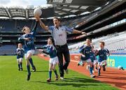 12 April 2011; The 2011 Vhi GAA Cúl Camps were officially launched this morning in Croke Park by Uachtarán Chumann Lúthchleas Gael Criostóir Ó Cuana and Declan Moran of Vhi Healthcare. With over 1,000 camps taking place in Ireland and overseas, and over 83,000 children aged 6-14 years participating, the Vhi GAA Cúl Camps are the most popular children’s sporting camps in the country. Pictured in attendance are Kildare manager Kieran McGeeney with children, from left to right, Charlie McCarthy age 8, his sister Kate McCarthy, age 6, both from Dublin, Stephen Carey age 8, from Kildare, and Conor O'Driscoll, age 7, from Meath, and Aoife Donovan age 6, from Dublin. Vhi GAA Cúl Camps Ambassador Launch 2011, Croke Park, Dublin. Picture credit: Barry Cregg / SPORTSFILE