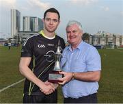 25 November 2016; The captain of the 2015 All Stars team Dean Rock, Dublin, is presented with the trophy by Uachtarán Chumann Lúthchleas Aogán Ó Fearghail after the GAA GPA All-Stars football tour sponsored by Opel at the Sheikh Zayed Sports City Stadium in Abu Dhabi, United Arab Emirates. Photo by Ray McManus/Sportsfile