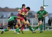15 April 2011; Chris Czekaj, Cardiff Blues, is tackled by Niva Ta'Auso, left, and Andrew Browne, right, Connacht. Celtic League, Connacht v Cardiff Blues, Sportsground, Galway. Picture credit: Barry Cregg / SPORTSFILE