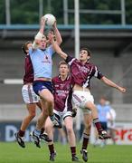 16 April 2011; Patrick O'Higgins, Dublin, cathes a high ball against Robbie Greville, left, Thomas Doyle, centre and David McCormack, Westmeath. Leinster GAA Football Minor Championship, First Round, Dublin v Westmeath, Parnell Park, Dublin. Picture credit: Barry Cregg / SPORTSFILE