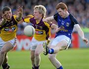 16 April 2011; Niall McDermott, Cavan, in action against Sean Gaule, 3, and John Leacy, Wexford. Cadbury GAA All-Ireland Football U21 Championship Semi-Final, Cavan v Wexford, Parnell Park, Dublin. Picture credit: Matt Browne / SPORTSFILE