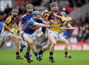 17 April 2011; Jim Berry, Wexford, in action against Eddie Connolly, Tipperary. Allianz Hurling League, Division 1, Round 7, Tipperary v Wexford, Semple Stadium, Thurles, Co. Tipperary. Picture credit: Brian Lawless / SPORTSFILE