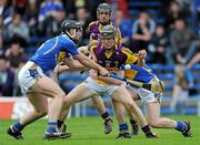 17 April 2011; Jim Berry, Wexford, in action against Conor O'Mahony, left, and Eddie Connolly, Tipperary. Allianz Hurling League, Division 1, Round 7, Tipperary v Wexford, Semple Stadium, Thurles, Co. Tipperary. Picture credit: Brian Lawless / SPORTSFILE