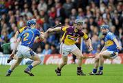 17 April 2011; Jim Berry, Wexford, in action against Eddie Connolly, left, and Paddy Stapleton, Tipperary. Allianz Hurling League, Division 1, Round 7, Tipperary v Wexford, Semple Stadium, Thurles, Co. Tipperary. Picture credit: Brian Lawless / SPORTSFILE