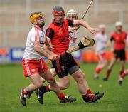 17 April 2011; Artie McGuinness, South Down, in action against and Tony Hughes, left, and Cathal McErlean, Tyrone. Allianz GAA Hurling Division 4 Final, South Down v Tyrone, Athletic Grounds, Armagh. Picture credit: Oliver McVeigh / SPORTSFILE