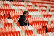 17 April 2011; Ronan Beattie, 13 years old, from Carryduff, Co. Down watches the game from the stand. Allianz GAA Hurling Division 4 Final, South Down v Tyrone, Athletic Grounds, Armagh. Picture credit: Oliver McVeigh / SPORTSFILE