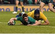 26 November 2016; Garry Ringrose of Ireland scores his side's second try despite the tackle of Dean Mumm of Australia during the Autumn International match between Ireland and Australia at the Aviva Stadium in Dublin. Photo by Brendan Moran/Sportsfile