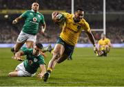 26 November 2016; Sefanaia Naivalu of Australia scores his side's third try despite the attempted tackle of Conor Murray of Ireland during the Autumn International match between Ireland and Australia at the Aviva Stadium in Dublin. Photo by Matt Browne/Sportsfile
