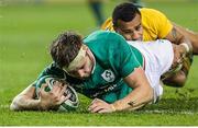 26 November 2016; Iain Henderson of Ireland scores his side's first try despite the tackle of Will Genia of Australia  during the Autumn International match between Ireland and Australia at the Aviva Stadium in Dublin. Photo by John Dickson/Sportsfile