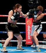 26 November 2016; Katie Taylor, left, exchanges punches with Karina Kopinska during their Super-Featherweight fight at Wembley Arena in London, England. Photo by Stephen McCarthy/Sportsfile