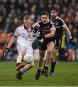 27 November 2016; Christopher Bradley of Slaughtneil in action against Aaron Branagan of Kilcoo during the AIB Ulster GAA Football Senior Club Championship Final game between Slaughtneil and Kilcoo at the Athletic Grounds in Armagh. Photo by Oliver McVeigh/Sportsfile