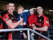 27 November 2016; Kenmare players Mark Crowley, with his son Flynn Crowley, and Shane Dalton with his daughter Eabha Dalton, aged 1, celebrate after the AIB Munster GAA Football Intermediate Club Championship Final between Kenmare and Adare at Mallow GAA Complex in Mallow, Co Cork. Photo by Diarmuid Greene/Sportsfile