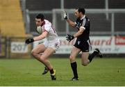 27 November 2016; Shane McGuigan of Slaughtneil in action against Aidan Branagan of Kilcoo during the AIB Ulster GAA Football Senior Club Championship Final game between Slaughtneil and Kilcoo at the Athletic Grounds in Armagh. Photo by Oliver McVeigh/Sportsfile